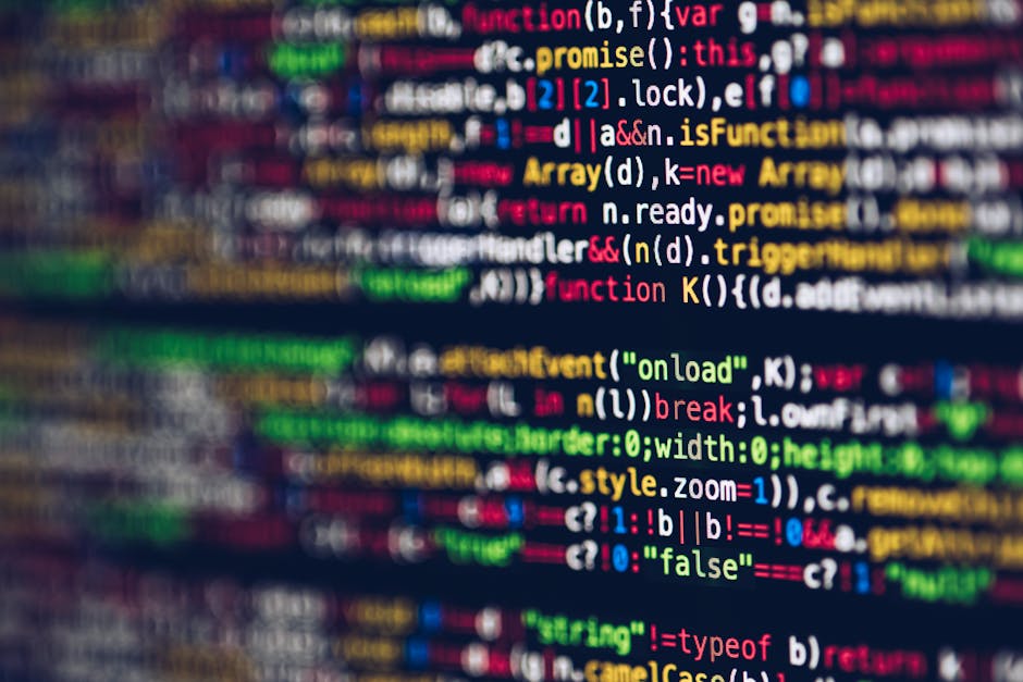 Photograph of a computer screen displaying lines of HTML code with colored syntax highlighting, including tags, attributes, and image file links. The code is displayed on a dark background, and the sc